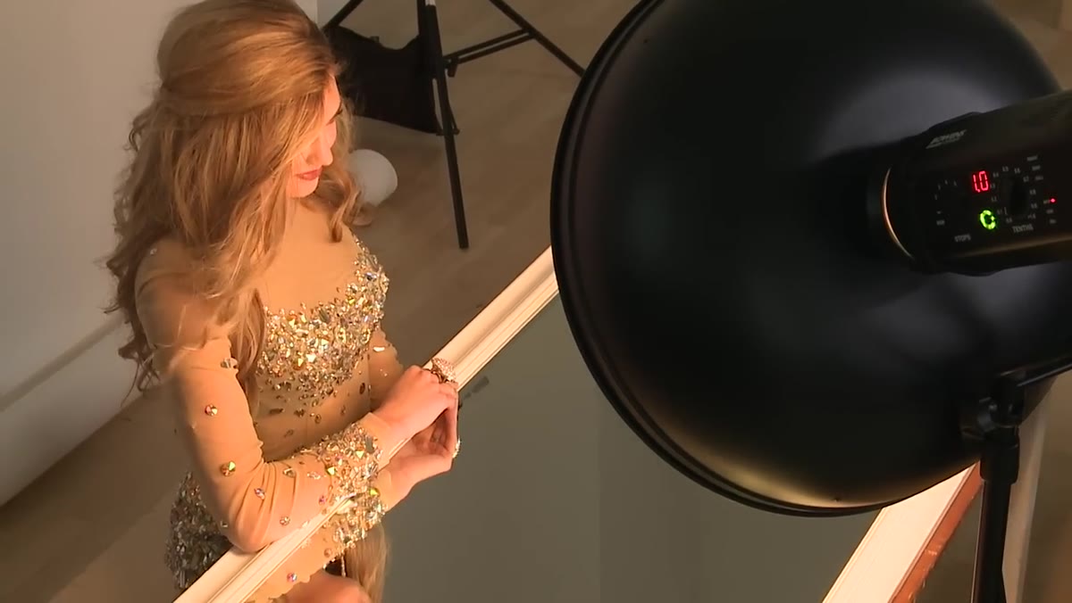 Bare beauty dish illuminating subject, showing harder contrast on skin