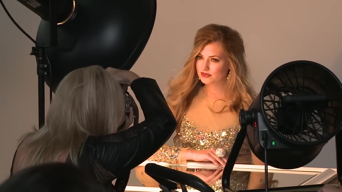 Sock diffuser being placed over beauty dish, power being increased