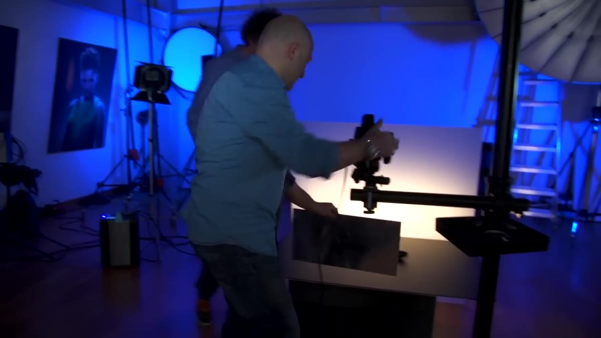 Silver reflector panel positioned at camera angle filling shadow side of spoons