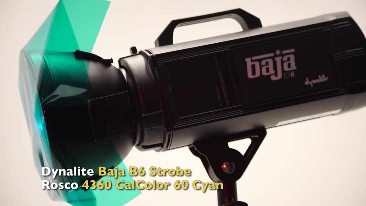 Cyan-gelled rim lights creating edge separation on subject