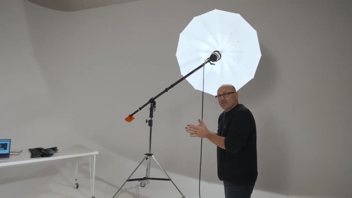 Demonstrating where subject would be positioned under the umbrella