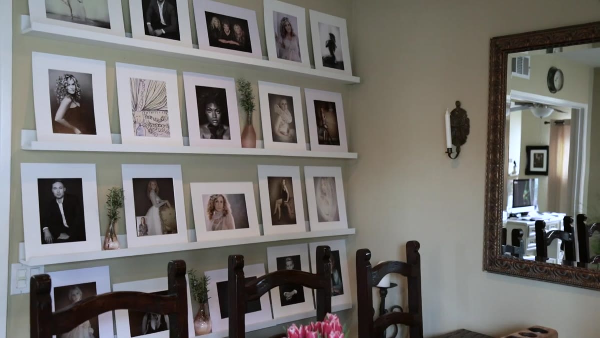 Reveal wall and table setup with candles and print boxes