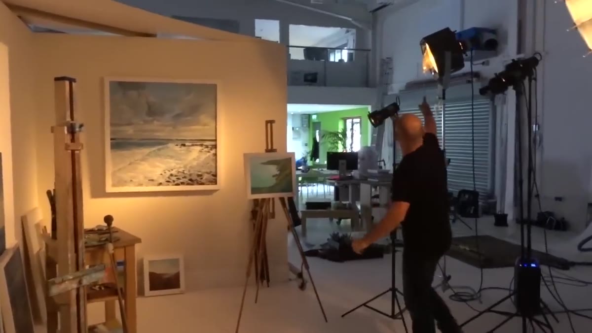 Fresnel light grazing the paintings on the background wall