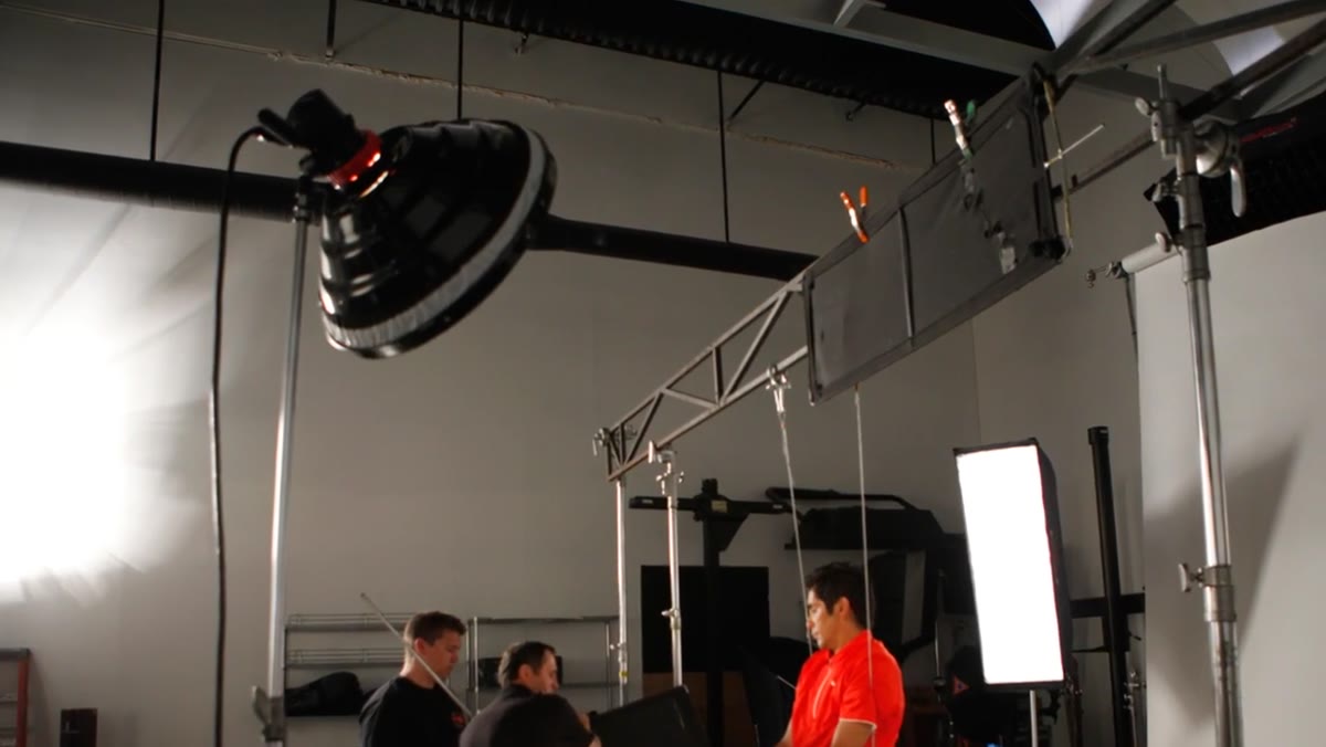 Beauty dish being set up in front of the subject