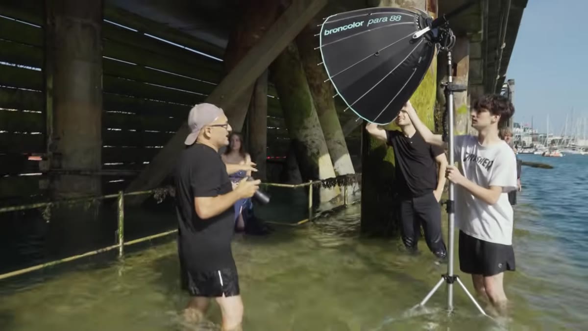 Flash unit aimed directly at model in shadowed corner of harbor
