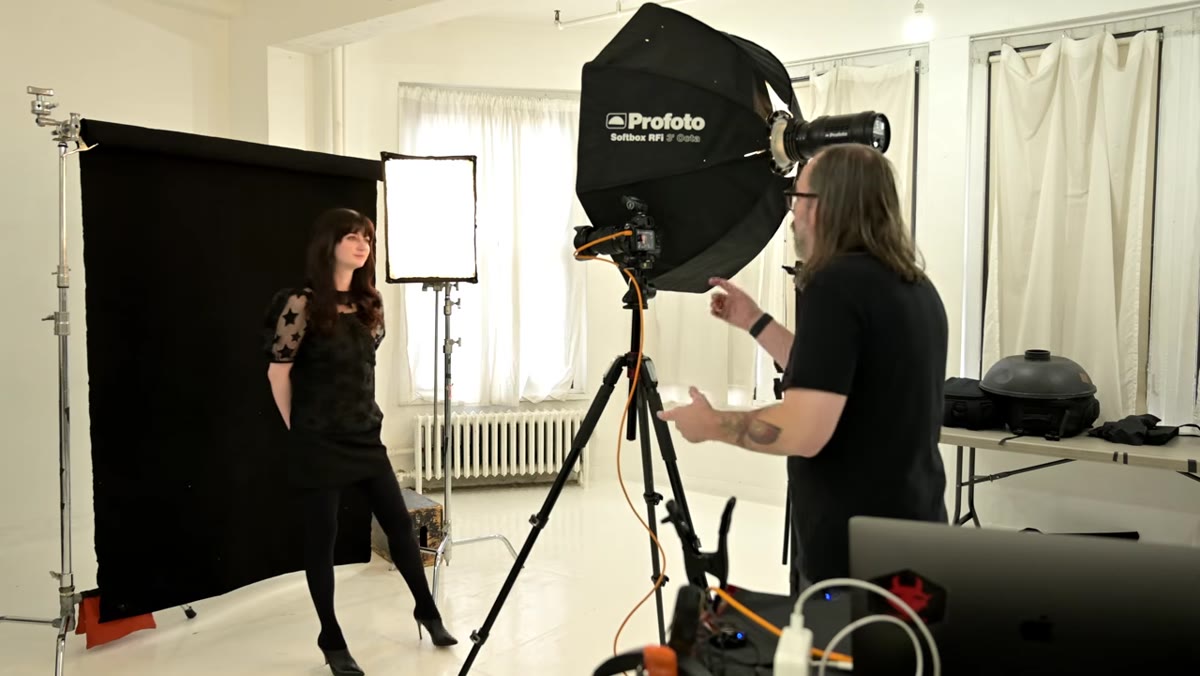 Photographer adjusting fill light power on camera trigger