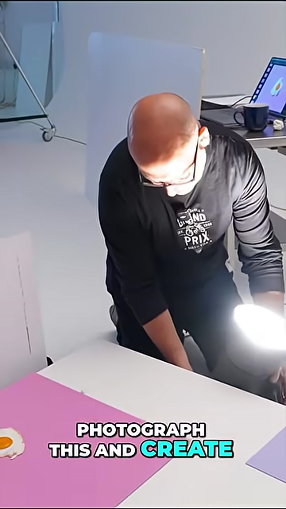 Karl holding a plate with a fried egg overhead