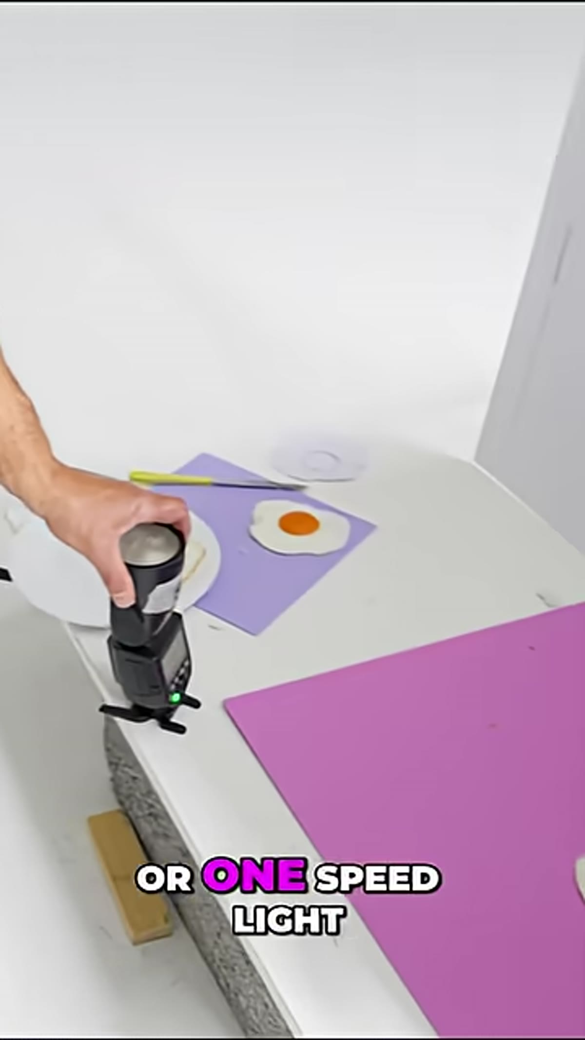 Single studio light or speedlight positioned to the side