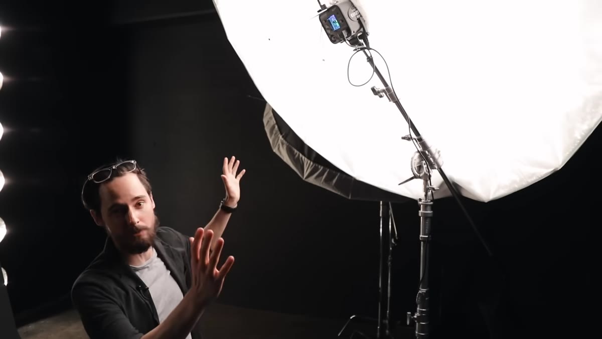 Large umbrella with diffusion fabric mounted on single strobe