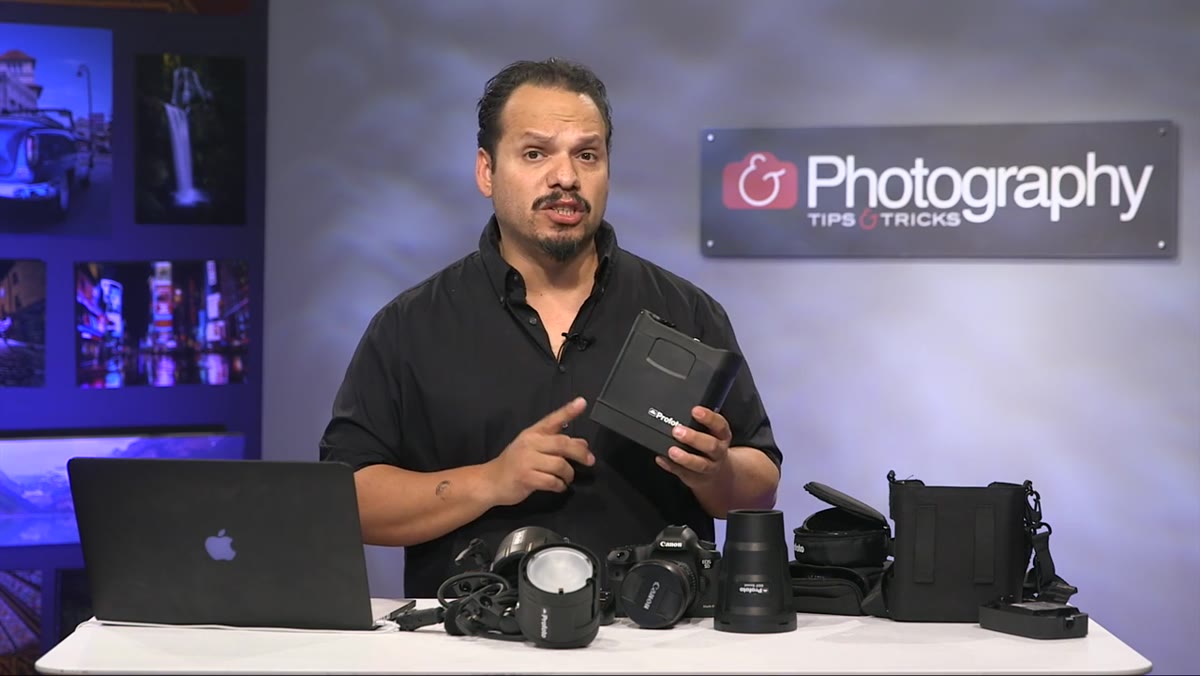 RC holds the Profoto B2 pack up to camera