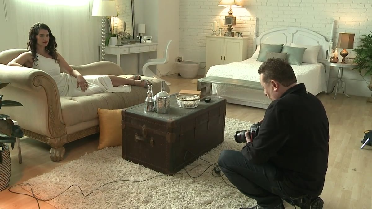 Photographer adjusting camera settings before shooting