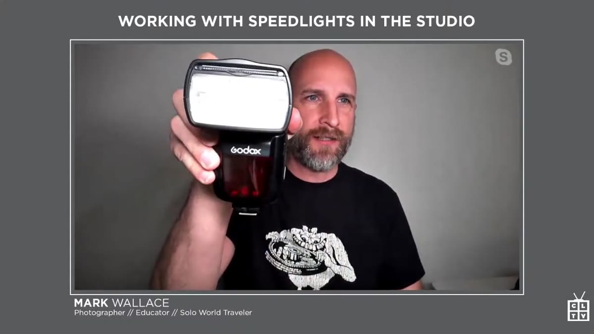 Mark pointing to Godox and Canon units on the table
