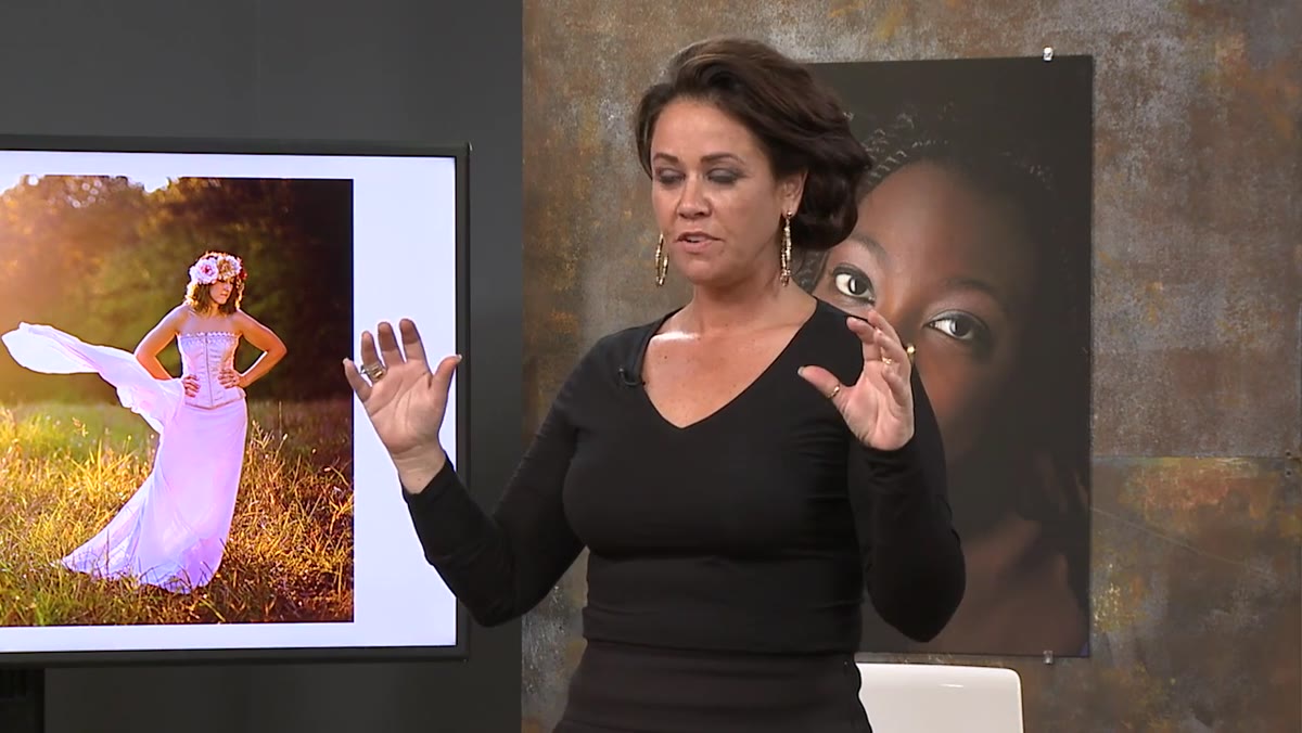 Sue demonstrating flowing hand movements to the class