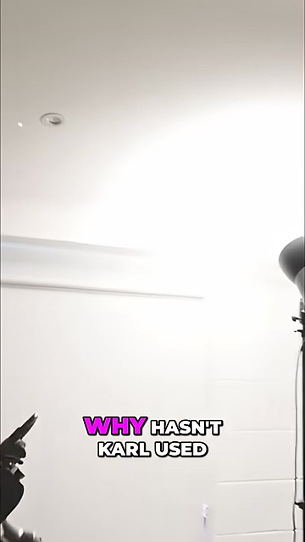 Instructor gesturing toward ceiling reflection point