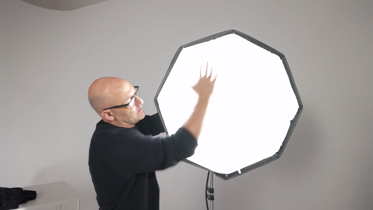 Octabox mounted on studio strobe showing illuminated front diffuser panel