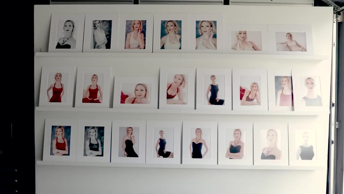 Reveal wall setup with framed images for client viewing