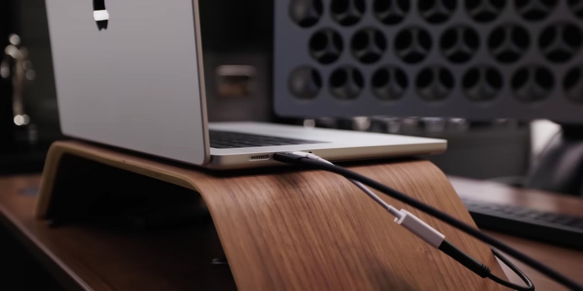 Laptop elevated on Grove Made stand next to main monitor