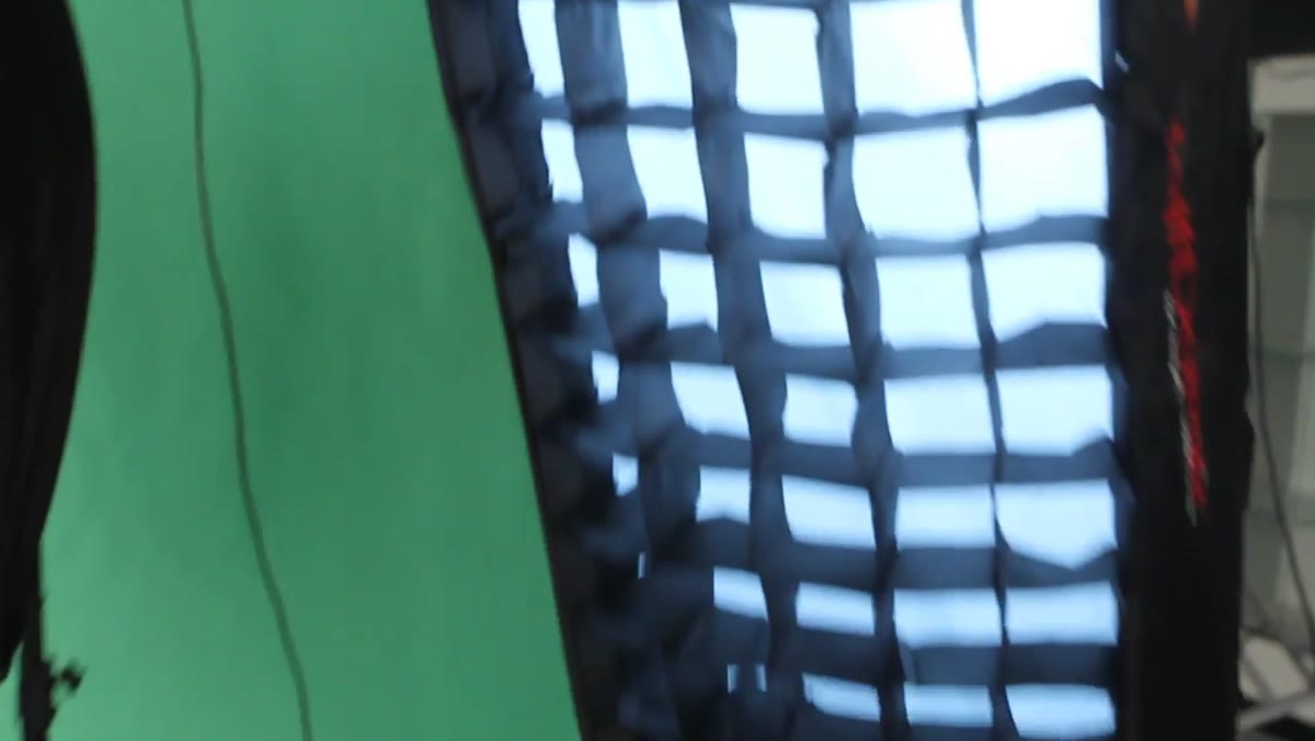 Softbox with grid showing restricted light spread on wall