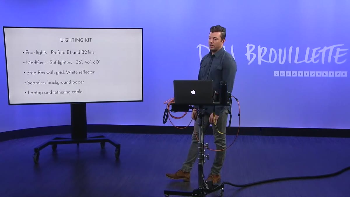 Photographer explaining tethered shooting and on-set review process