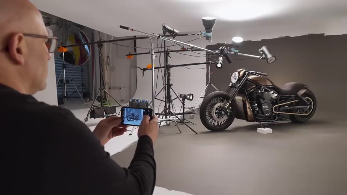 iPhone being used to photograph motorbike in same position